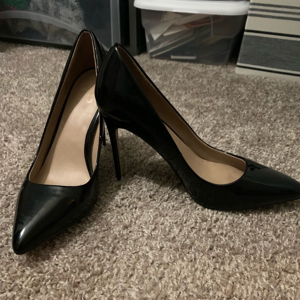 Fairly used black patent leather stiletto heels